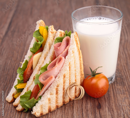 Photo: glass of milk and sandwich glass of milk and sandwich