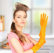 housewife with protective gloves