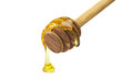 Honey dripping from a wooden of olives dipper