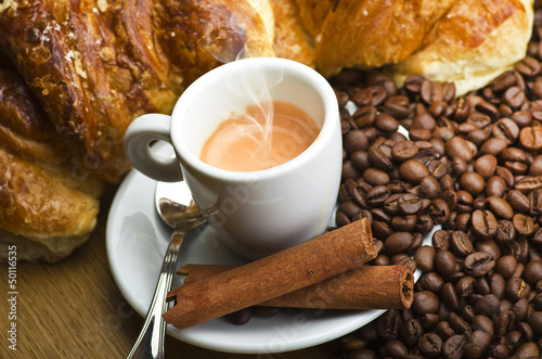 Photo: Coffee smoking on the coffee beans background Coffee smoking on the coffee beans background