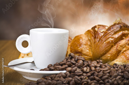 Photo: Coffee smoking on the coffee beans background Coffee smoking on the coffee beans background