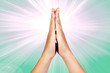 Hands clasped in prayer