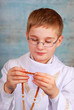 boy going to the first holy communion with rosary