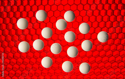 Photo: White pills on a red high tech grid background White pills on a red high tech grid background