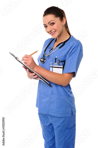 Photo: Medical professional writing case history Medical professional writing case history