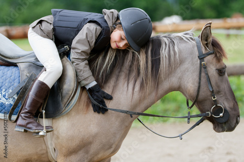 Photo: Horse riding - lovely equestrian on a horse Horse riding - lovely equestrian on a horse