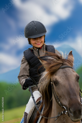 Photo: Horse riding - lovely equestrian on a horse Horse riding - lovely equestrian on a horse