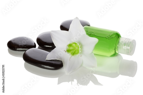 Photo: spa items - liquid soap, stones and flower spa items - liquid soap, stones and flower
