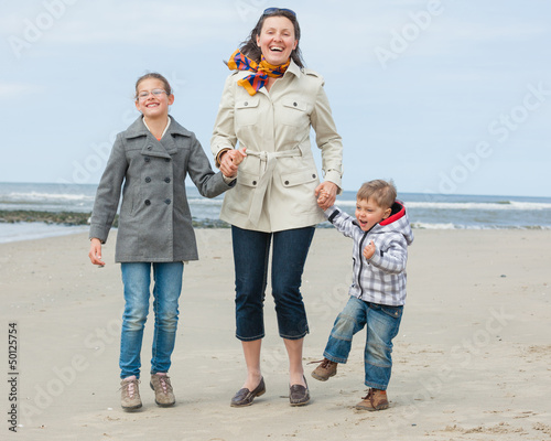Photo: Mother and her kids at the beach Mother and her kids at the beach