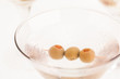 Dry Martini Cocktail with olives extreme close up