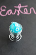 Foto: Blue easter egg shaped candle and text Blue easter egg shaped candle and text
