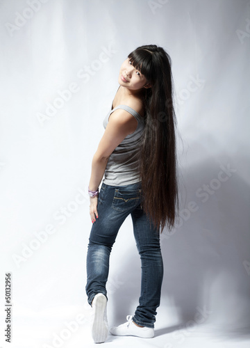 Photo: back view of standing young beautiful Asian woman back view of standing young beautiful Asian woman