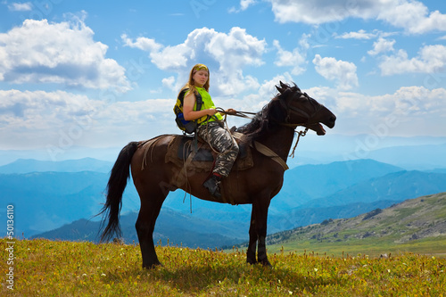Photo: Female rider on horseback Female rider on horseback