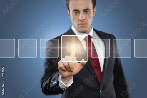 Photo: Man touching display Man touching display