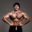 Photo: Muscular guy working out with dumbbells Muscular guy working out with dumbbells