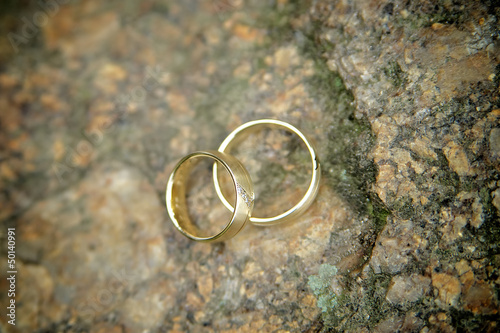 Photo: Golden Wedding Rings on a Stone Golden Wedding Rings on a Stone