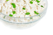 Fresh cottage cheese (curd) in glass bow, isolated on white back