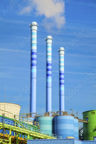 Photo: blue chimney in industry plant with smoke blue chimney in industry plant with smoke
