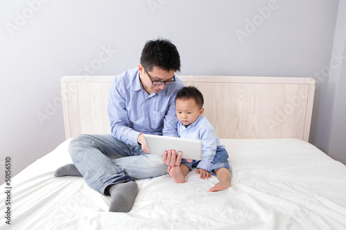 Photo: happy family using tablet pc happy family using tablet pc