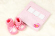 Baby photo album on white carpet