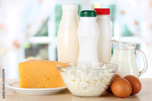 Photo: Dairy products and eggs on table in kitchen Dairy products and eggs on table in kitchen