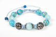 Popular Buddhist bracelet shamballa on a white background.