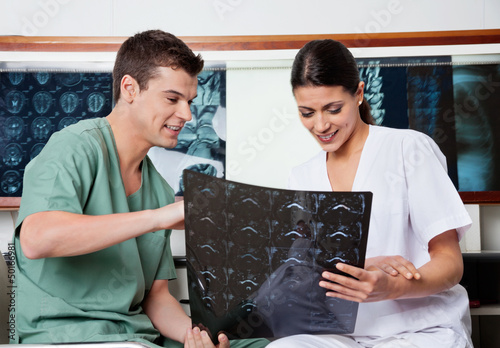 Photo: Medical Technicians Reviewing MRI X-ray Medical Technicians Reviewing MRI X-ray