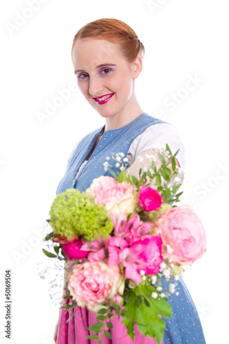 Photo: Junge Frau im Dirndl mit Blumenstrauß Junge Frau im Dirndl mit Blumenstrauß
