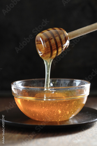 Photo: Honey dripping off of dipper Honey dripping off of dipper