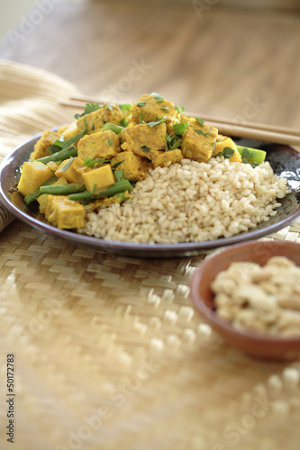 Photo: Curry soy tempeh and rice in bowl Curry soy tempeh and rice in bowl