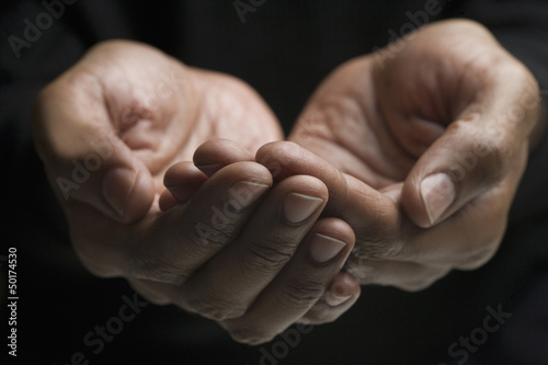 Photo: Close up of mixed race man's hands Close up of mixed race man's hands