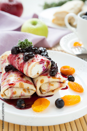 Photo: berry-cheese pancakes with sauce berry-cheese pancakes with sauce