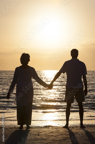Photo: Senior Couple Holding Hands Sunset Tropical Beach Senior Couple Holding Hands Sunset Tropical Beach