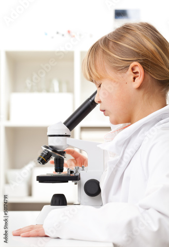 Photo: Girl with microscope Girl with microscope