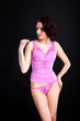 Foto: girl in lacy pink underwear on black background girl in lacy pink underwear on black background