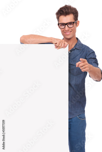 Photo: happy man with panel, pointing happy man with panel, pointing