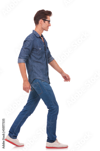 Photo: side view of man walking side view of man walking