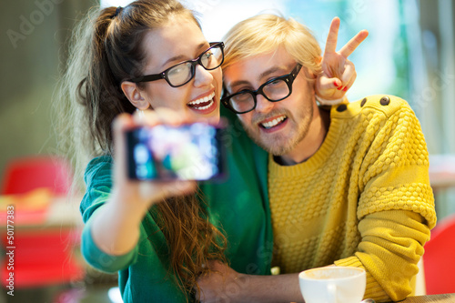 Photo: Couple taking self portrait Couple taking self portrait