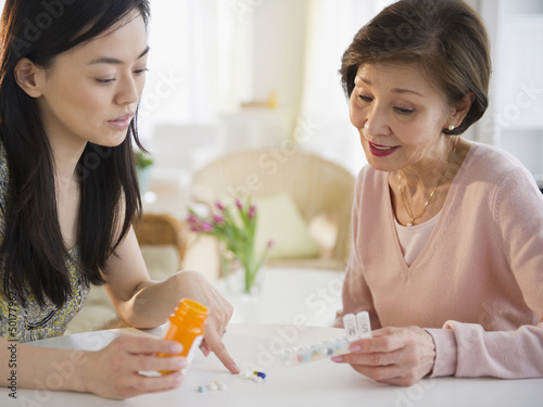 Photo: Japanese daughter explaining, medication to mother Japanese daughter explaining, medication to mother