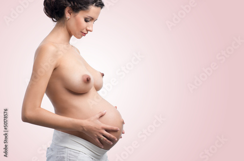 Photo: beautiful young pregnant woman with bare breasts beautiful young pregnant woman with bare breasts