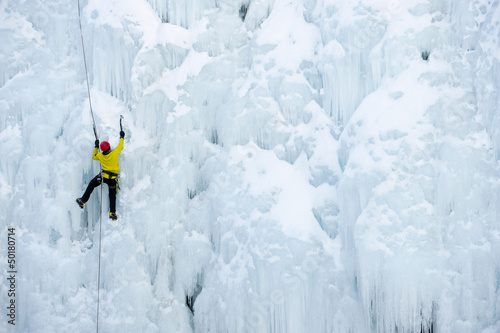 Photo: Caucasian man climbing ice Caucasian man climbing ice