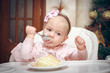 Little girl with a sweet cake in birthday