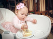 Little girl with a sweet cake in birthday