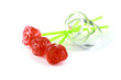 sugar candies in the form of a red rose on a stick