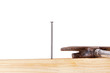 Hammer and nail with wooden board
