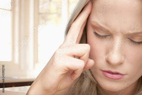 Photo: Caucasian woman with headache Caucasian woman with headache