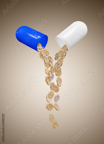 Photo: Broken capsule spilling out coins Broken capsule spilling out coins
