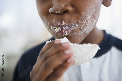 Photo: Messy Black boy eating donut Messy Black boy eating donut