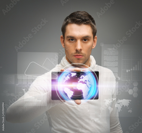 Photo: man with tablet pc and virtual screens man with tablet pc and virtual screens