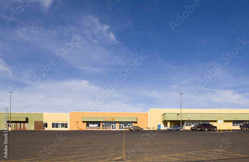 Photo: Empty parking lot in strip mall Empty parking lot in strip mall